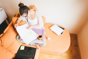 Student studying on sofa