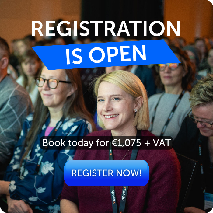 graphic showing attendees seated in a conference audience, with a smiling participant in the foreground. Large text reads “Registration is open,” with “Is open” highlighted in blue. Below, text states “Book today for €1,075 + VAT,” followed by a blue “Register now!” button.